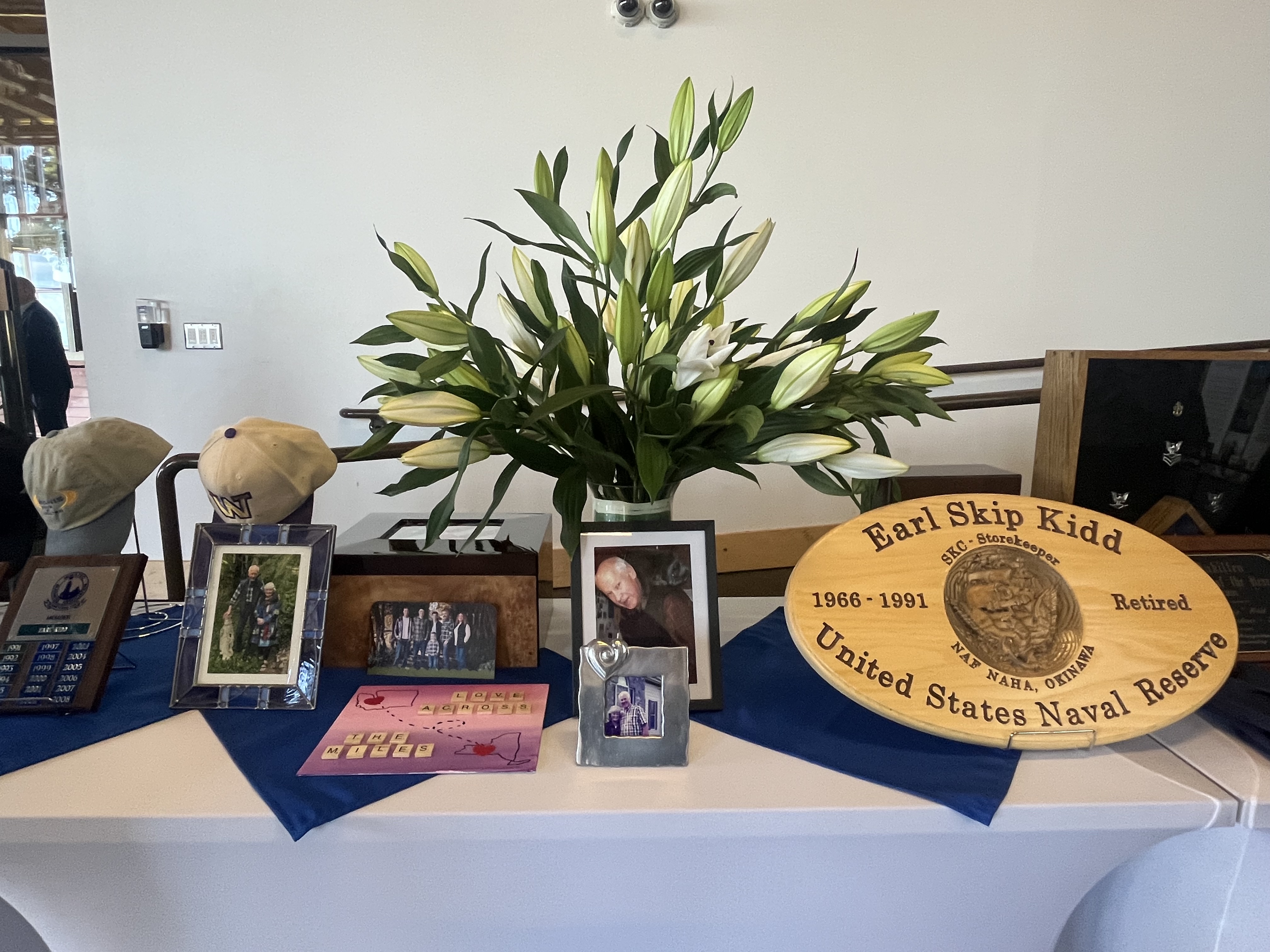 Reception setup for a celebration of life with candles and florals