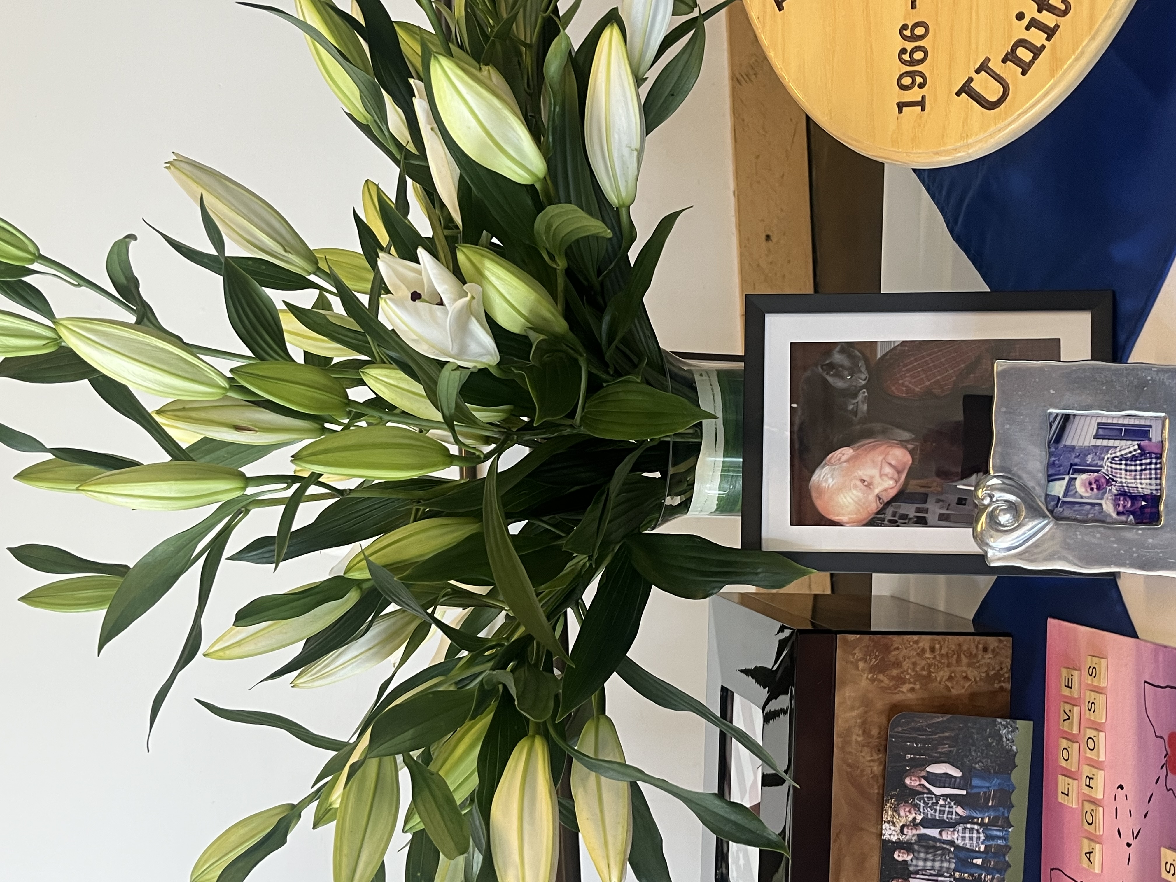 Celebration of life décor with candles and floral tributes